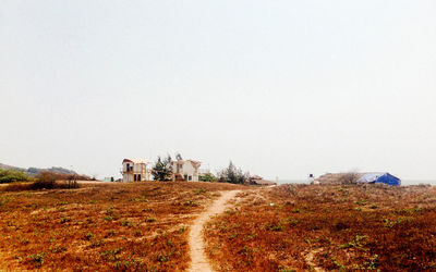 Narrow track on countryside landscape