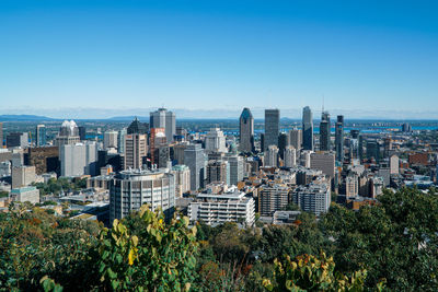 View of modern buildings against blue sky