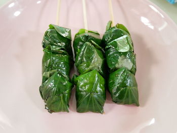 High angle view of leaves in plate