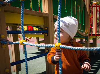 Full length portrait of cute girl in playground