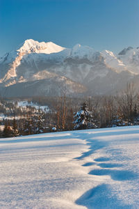 Scenic view of snowcapped mountains against sky