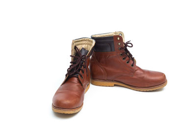 Close-up of shoes against white background