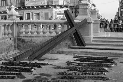Cross and chains on walkway