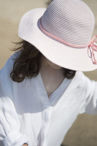 Rear view of woman with hat