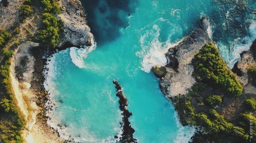 High angle view of rocks in sea