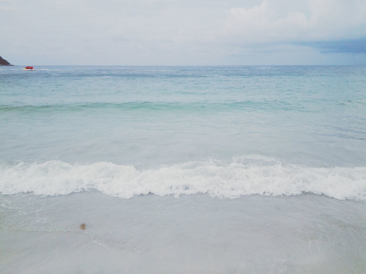 sea, horizon over water, water, beach, wave, scenics, sky, tranquil scene, beauty in nature, shore, tranquility, nature, surf, seascape, idyllic, sand, day, remote, outdoors, coastline