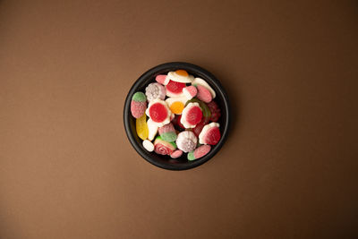 High angle view of multi colored candies in bowl