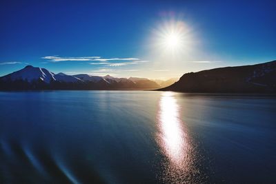 Scenic view of lake against blue sky