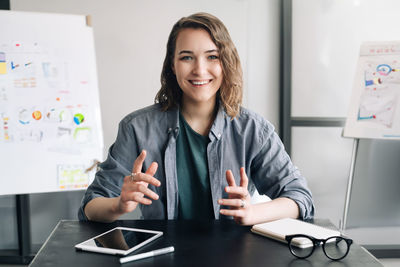 Beautiful business woman conducting a video conference, communicating 