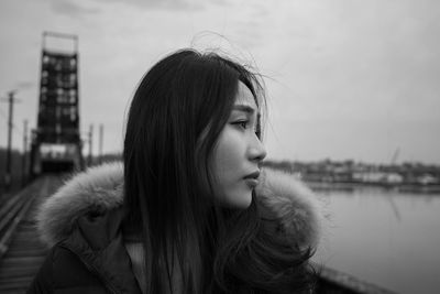 Young woman looking away in city