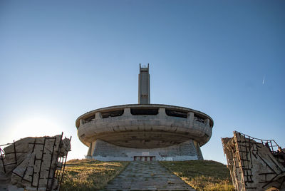 Low angle view of historical building against clear blue sky