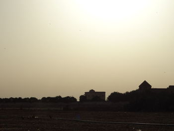 Built structure on field against clear sky