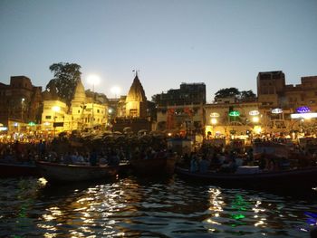 Canal passing through city at night