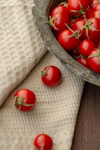 High angle view of cherry tomatoes on wood