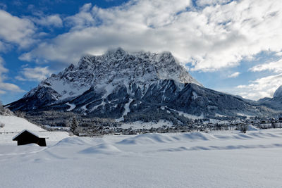 Scenic view of snowcapped mountains against sky