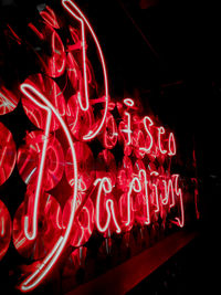 Close-up of illuminated text against black background