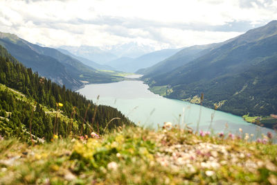 Scenic view of lake and mountains against sky