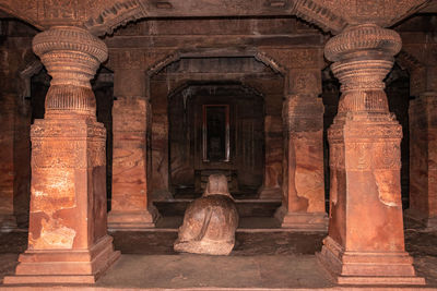 Badami cave sculptures of hindu gods carved on roof ancient stone art in details