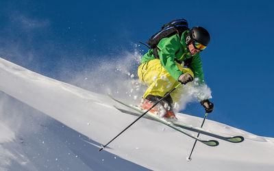 Man skiing on snowcapped mountain