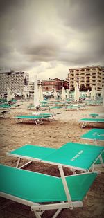 Scenic view of beach against sky in city