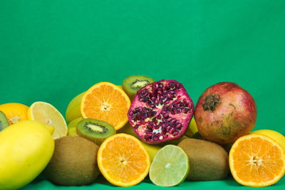 Close-up of fruits against blue background