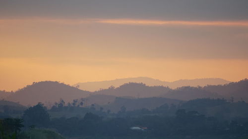 Scenic view of mountains against sky during sunset