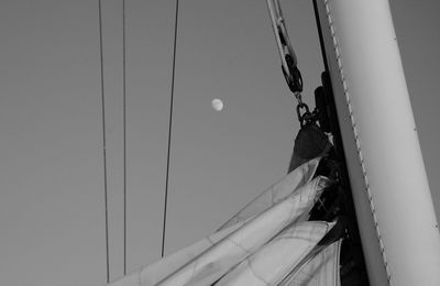 Close-up of sailboat mast against sky at dusk