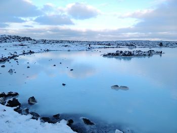 Scenic view of frozen lake against sky