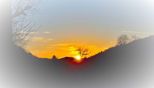 Scenic view of silhouette mountain against sky during sunset