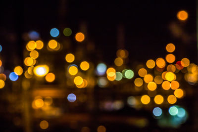 Defocused image of illuminated city at night