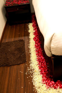 High angle view of red flowering plants in house