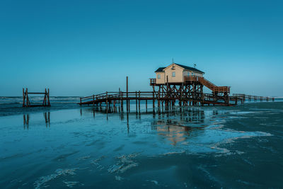 Pile dwelling on the beach of sankt peter-ording in germany.