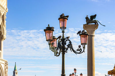 Low angle view of street light against sky