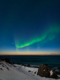 Scenic view of sea against sky at night