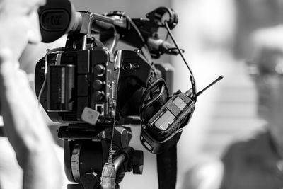 Cameras at a media conference outdoors.