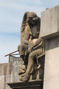 Low angle view of statue against sky