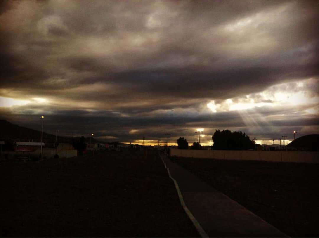 DRAMATIC SKY OVER CITY DURING SUNSET