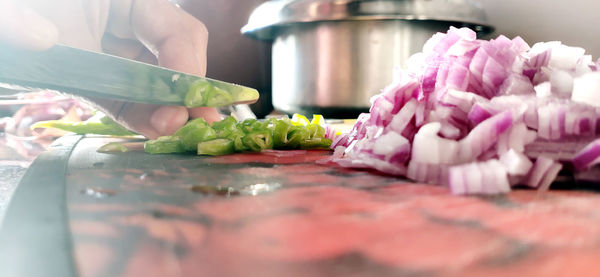 Midsection of man preparing food in kitchen