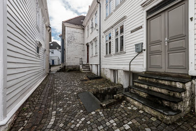 Footpath amidst old houses