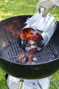 High angle view of meat on barbecue grill in yard