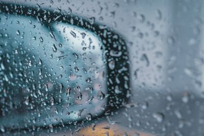 Close-up of raindrops on glass window