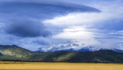 Scenic view of snowcapped mountains against sky