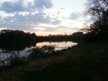 Scenic view of lake against sky during sunset