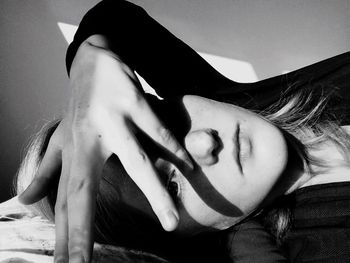 Young woman covering face