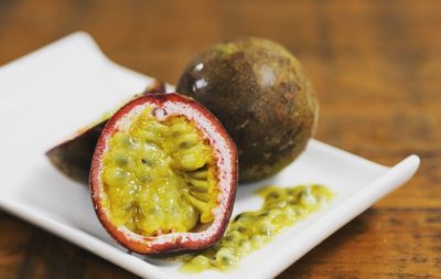 High angle view of passionfruite in plate on table
