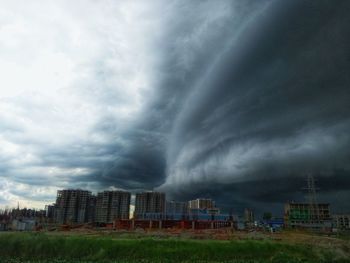 Storm clouds over city buildings