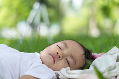 Girl sleeping on grass