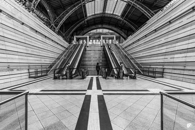 People walking on railroad station platform