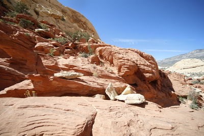 Rock formation on mountain against sky