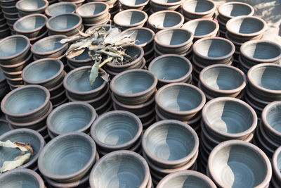 Full frame shot of stacked empty bowls for sale at market